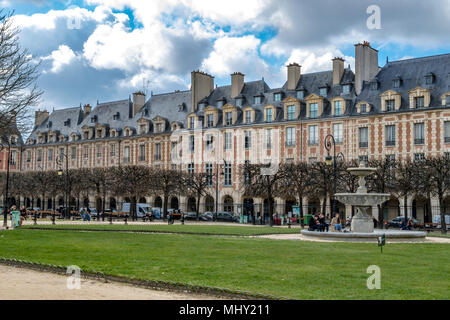 Elegant rooftops and windows adorn the buildings at Place des Vosges in The Marais district of Paris,one of the most beautiful squares in Paris Stock Photo