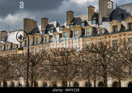 Elegant rooftops and windows adorn the buildings at Place des Vosges in The Marais district of Paris,one of the most beautiful squares in Paris Stock Photo