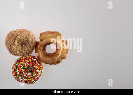 donuts of various size color and shape.  copy space in frame. Stock Photo