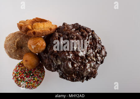 donuts of various size color and shape.  copy space in frame. Stock Photo