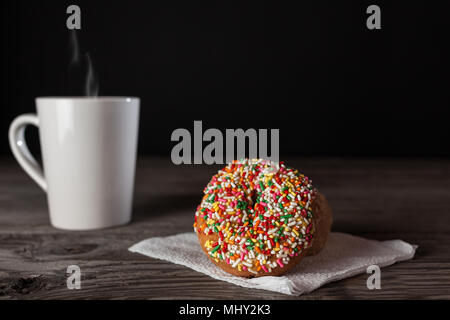 donuts of various size color and shape.  copy space in frame. Stock Photo