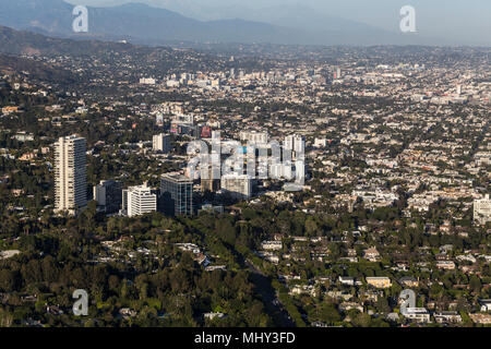 West Hollywood, California, USA - April 18, 2018:  Aerial view of towers and buildings along the Sunset Strip with Los Angeles in background. Stock Photo