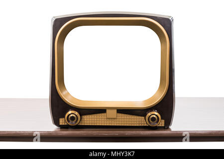 Vintage 1950s television on table isolated on white with empty screen and clipping path. Stock Photo