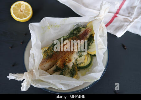 Fish En Papillote Fish baked in Parchment Paper Stock Photo