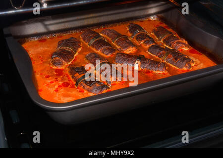 Fresh beef roulades braised in a dish in the oven. Stock Photo