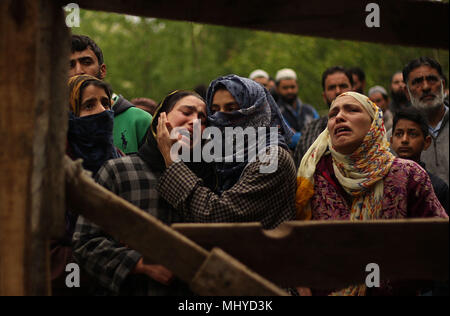 Shopian, India. 03rd May, 2018. Kashmiri women mourn the death of a teenager Umar Kumar in Pinjoora some 50 kilometers from Srinagar the summer capital of Indian controlled Kashmir on May 03, 2018. Umar was shot dead by government forces after the clashes erupt following a gun battle between rebels and Indian forces in Turkewangam area of south Kashmir's Shopian. Later the rebels managed to escape from the site of gun-battle, local residents said. Credit: Faisal Khan/Pacific Press/Alamy Live News Stock Photo