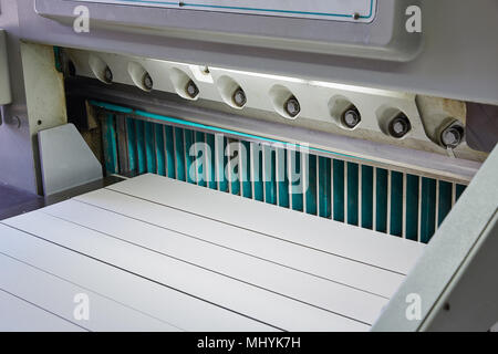 Cutting paper guillotine Shears machine in a printing factory Stock Photo