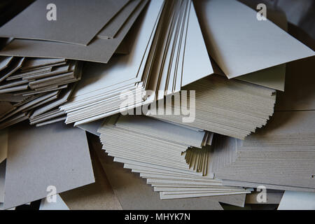 Cartoon paper ream from Cutting guillotine Shears machine in a printing factory Stock Photo