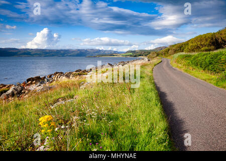 Scenic winding road along the sea Loch Caolisport at Kintyre peninsula, Argyll and Bute, Scotland, UK Stock Photo