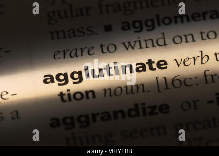 agglutinate word in a dictionary. agglutinate concept. Stock Photo