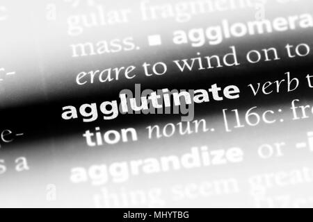 agglutinate word in a dictionary. agglutinate concept. Stock Photo