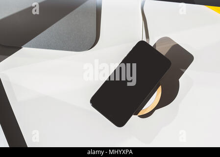 Mobile placed on wireless charger. Future technology concept Stock Photo