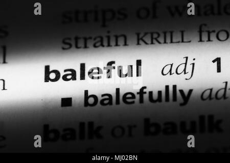 baleful word in a dictionary. baleful concept Stock Photo - Alamy