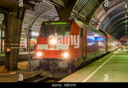 Electric lovomotive with regional express train in Karlsruhe station, Germany Stock Photo