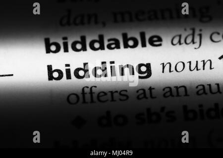 bidding word in a dictionary. bidding concept. Stock Photo
