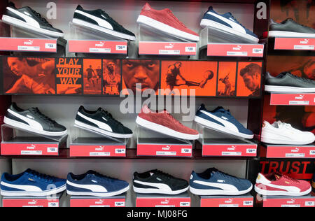 Puma training shoes in Sports Direct store. UK Stock Photo