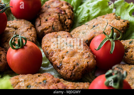 Chickpeas Falafel with parsley and cherry tomatoes. (selective focus) Stock Photo