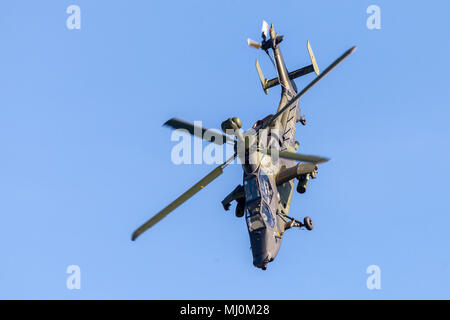 BERLIN / GERMANY - APRIL 28, 2018: Military twin-engined attack helicopter Tiger, from Airbus Helicopters flies at airport Berlin / Schoenefeld. Stock Photo