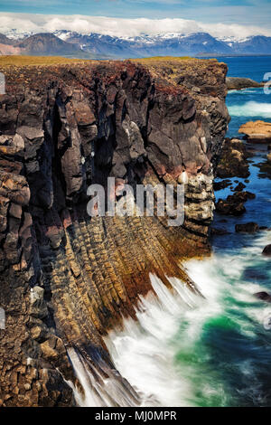 basalt rock formations long exposure at hellnar cliffs snaefellsnes iceland Stock Photo