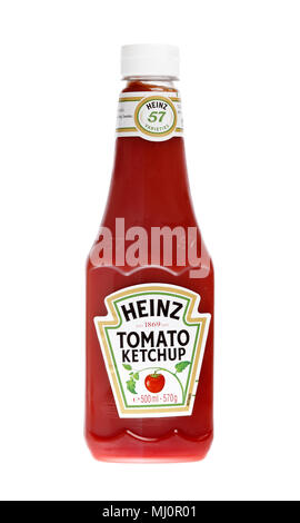 One plastic bottle filled with 570 g of Heinz tomato ketchup, isolated on white background. Stock Photo