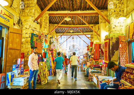 DOHA, QATAR - FEBRUARY 13, 2018: Interior of medieval Souq Waqif with stone and adobe walls, timbered ceiling and numerous small stalls, full of diffe Stock Photo