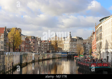 View of famous Bloemenmarkt (a floating flower market) and the Singel canal. Amsterdam, The Netherlands, Europe. Stock Photo