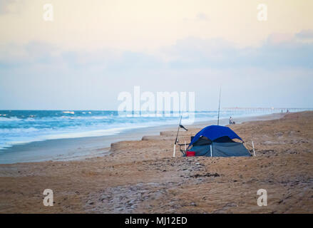 A tent and fishing pole on a Florida Beach Stock Photo