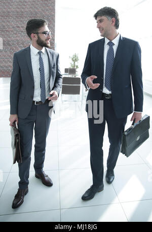 Two company employees discuss business issues Stock Photo