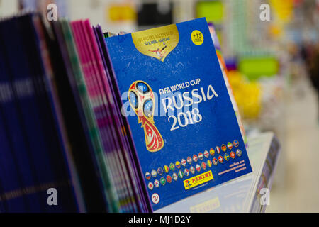 MOSCOW, RUSSIA - APRIL 27, 2018: Official album for stickers dedicated to the World Cup on the shelf of the Auchan supermarket with the symbols of the Stock Photo