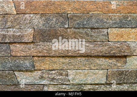 Decorative stone for decoration of the fireplace. Background. Stock Photo