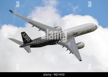BERLIN - APR 27, 2018: New Airbus A350 XWB passenger plane performing at the Berlin ILA Air Show. Stock Photo