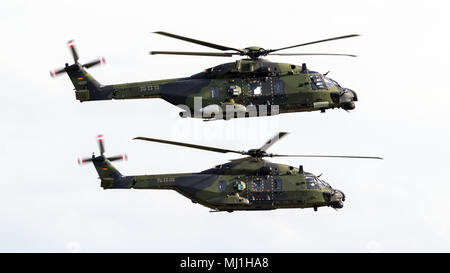 BERLIN - APR 27, 2018: German Army NHIndustries NH90 TTH helicopter formation at the Berlin ILA Air Show. Stock Photo