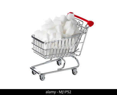 One shopping cart filled with sugar cubes isolated on white. Stock Photo