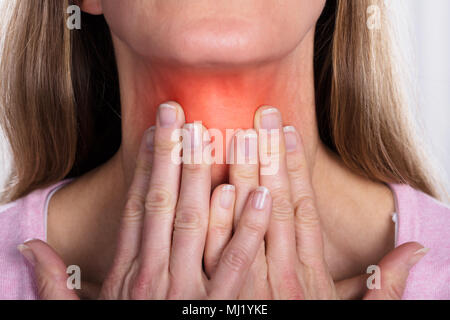 Close-up Of Mature Female Suffering From Gland Inflammation Stock Photo