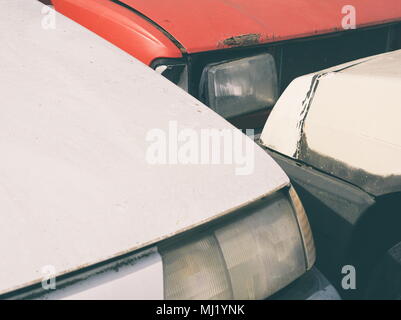 Car Junkyard White and Red Cars Front Abstract Closeup Stock Photo
