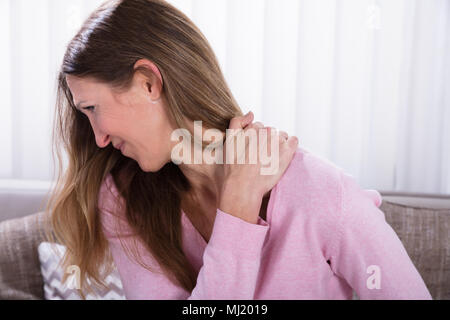 Close-up Of Mature Woman Suffering From Backache Stock Photo