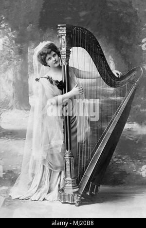 Music, woman playing harp, 1910s, Germany Stock Photo