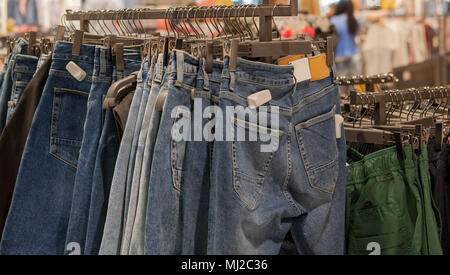 Premium Photo  Jeans shorts on the store shelf. fashionable clothes on the  shelves in the store