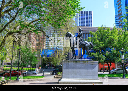 Portland, Oregon, USA - April 27, 2018 : Theodore Roosevelt, Rough Rider statue, and Oregon Historical Society Museum, South Park Blocks Stock Photo