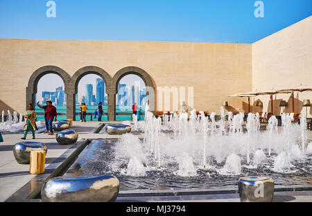 DOHA, QATAR - FEBRUARY 13, 2018: Islamic Art Museum boasts beautiful open air terrace with refreshing fountains, futuristic benches and cozy cafe, on  Stock Photo