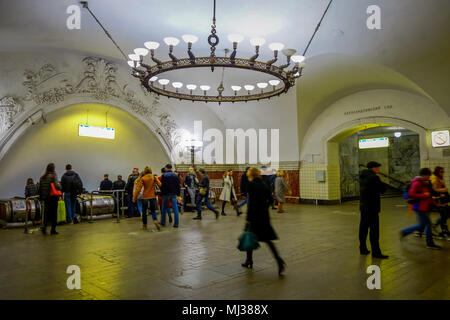 MOSCOW, RUSSIA- APRIL, 29, 2018: People walking inside of Beautifully decorated metro station, It is one of busiest in whole system and is most loaded one on line, opened on 30 January 1952 Stock Photo