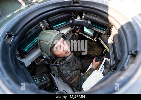 19 April 2018, Germany, Munster: A Bundeswehr commander sitting in a Leopard 2 A7 tank. Photo: Philipp Schulze/dpa Stock Photo