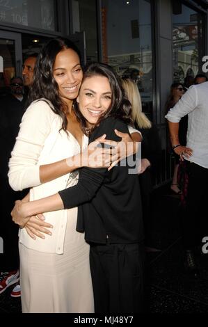 Zoe Saldana, Mila Kunis at the induction ceremony for Star on the