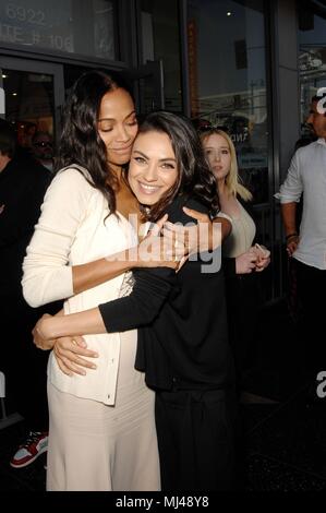 Zoe Saldana, Mila Kunis at the induction ceremony for Star on the