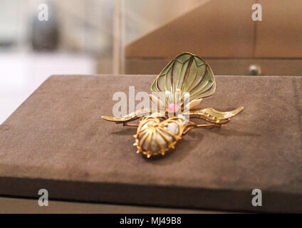 03 May 2018, Latvia, Riga: A French orchid brooch of jeweller Georges Fouquet (1862-1957) is on display at the art museum of Riga's stock exchange. The exhibition showcasing art nouveau items will run until 5 August and present around 200 pieces from the art historical period around 1900. Photo: Alexander Welscher/dpa Stock Photo