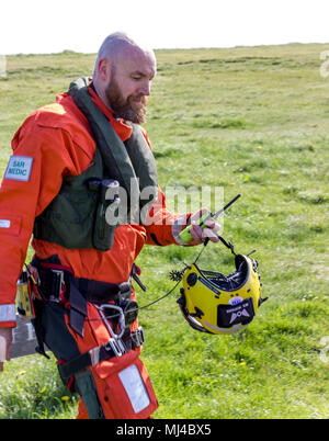 Beachy Head, Eastbourne, United Kingdom. 4th May 2018. The Coastguard Helicopter along with Sussex police and a local Coastguard ground crew respond to an incident at the base of Beachy Head cliffs. Initial reports indicate that what was thought to be a body seen in the water was in fact a mannequin placed there earlier by a film crew and possibly thrown from the cliff.  Eastbourne Council are making enquiries saying, filming permission was not given in the area. Yesterday 2 bodies were recovered from the cliff base, a male in vehicle and an unrelated female.Credit: Alan Fraser/Alamy Live News Stock Photo