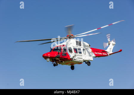 Beachy Head, Eastbourne, United Kingdom. 4th May 2018. The Coastguard Helicopter along with Sussex police and a local Coastguard ground crew respond to an incident at the base of Beachy Head cliffs. Initial reports indicate that what was thought to be a body seen in the water was in fact a mannequin placed there earlier by a film crew and possibly thrown from the cliff.  Eastbourne Council are making enquiries saying, filming permission was not given in the area. Yesterday 2 bodies were recovered from the cliff base, a male in vehicle and an unrelated female.Credit: Alan Fraser/Alamy Live News Stock Photo