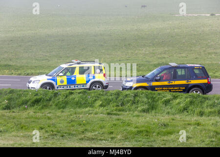 Beachy Head, Eastbourne, United Kingdom. 4th May 2018. The Coastguard Helicopter along with Sussex police and a local Coastguard ground crew respond to an incident at the base of Beachy Head cliffs. Initial reports indicate that what was thought to be a body seen in the water was in fact a mannequin placed there earlier by a film crew and possibly thrown from the cliff.  Eastbourne Council are making enquiries saying, filming permission was not given in the area. Yesterday 2 bodies were recovered from the cliff base, a male in vehicle and an unrelated female.Credit: Alan Fraser/Alamy Live News Stock Photo