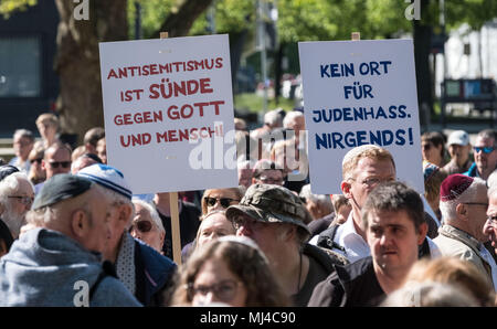 04 May 2018, Germany, Hanover: Participants of the Kippah Walk demonstrating solidarity with jewish citizens walking through Hanover with placards. Photo: Peter Steffen/dpa Stock Photo