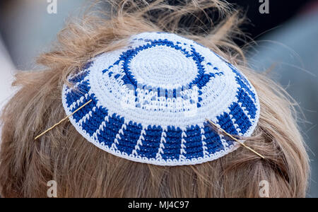 04 May 2018, Germany, Hanover: A participant of the Kippah Walk wearing a kippah and demonstrating solidarity with jewish citizens by walking through Hanover. Photo: Peter Steffen/dpa Stock Photo